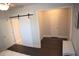 Walk-in closet features a barn door with dark, hard wood floors at 5315 Austrian Pine Ct, Cumming, GA 30040
