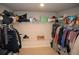 Walk-in closet with ample shelving and storage space for organizing clothes and accessories at 5315 Austrian Pine Ct, Cumming, GA 30040