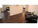 Inviting dining area with hardwood floors adjacent to the kitchen and living spaces at 5315 Austrian Pine Ct, Cumming, GA 30040