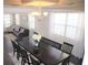 Bright dining room featuring a large table, chandelier, and view into living room at 5315 Austrian Pine Ct, Cumming, GA 30040