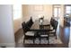 Elegant dining room featuring a large table, bench seating, and modern decor at 5315 Austrian Pine Ct, Cumming, GA 30040