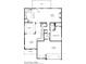 Detailed first floor plan showcasing kitchen, dining, living, garage, and bedroom layout for convenient living at 5315 Austrian Pine Ct, Cumming, GA 30040