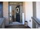 Inviting entryway with decorated door, 'Welcome' sign, and view into dining room with hardwood flooring at 5315 Austrian Pine Ct, Cumming, GA 30040