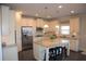 Updated kitchen with granite countertops, stainless steel appliances, and a breakfast bar at 5315 Austrian Pine Ct, Cumming, GA 30040