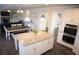 Spacious kitchen with granite island overlooking the living area, perfect for entertaining at 5315 Austrian Pine Ct, Cumming, GA 30040