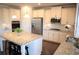 Modern kitchen featuring white cabinetry, granite countertops, and stainless steel appliances at 5315 Austrian Pine Ct, Cumming, GA 30040