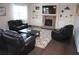 Cozy living room with a stone fireplace, built-in shelves, and plush seating arrangement at 5315 Austrian Pine Ct, Cumming, GA 30040