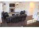 Comfortable living room featuring a stone fireplace, built-in shelving, and neutral decor at 5315 Austrian Pine Ct, Cumming, GA 30040