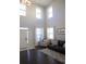 Spacious living room featuring high ceilings, ample natural light, and modern furnishings at 5315 Austrian Pine Ct, Cumming, GA 30040