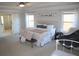 Bright main bedroom with a large window, soft carpet, and ensuite bathroom access at 5315 Austrian Pine Ct, Cumming, GA 30040