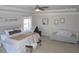 Spacious main bedroom with tray ceiling, neutral decor, and plenty of room for a seating area at 5315 Austrian Pine Ct, Cumming, GA 30040