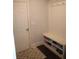 Mudroom with built-in bench, shoe storage, hooks, and neutral rug at 5315 Austrian Pine Ct, Cumming, GA 30040