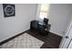Office area with dark desk, neutral walls, white trim and dark wood floors at 5315 Austrian Pine Ct, Cumming, GA 30040