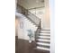 Beautiful staircase with wood and iron railings, and lots of natural light at 5315 Austrian Pine Ct, Cumming, GA 30040