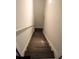 View of hardwood stairs with white risers and stringer leading to another level at 5315 Austrian Pine Ct, Cumming, GA 30040
