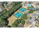 Aerial view of tennis courts, pool and playground, showcasing community recreational amenities at 4711 Oakleigh Manor Dr, Powder Springs, GA 30127