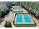 Aerial view showcasing tennis courts and basketball court, highlighting community amenities at 4711 Oakleigh Manor Dr, Powder Springs, GA 30127