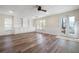 Basement with built-in shelves, a door to the backyard and wide plank flooring at 4711 Oakleigh Manor Dr, Powder Springs, GA 30127