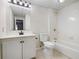 Bathroom with tiled floors, a vanity, and a tub with a shower at 4711 Oakleigh Manor Dr, Powder Springs, GA 30127