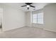 Bedroom with a ceiling fan and large windows providing natural light at 4711 Oakleigh Manor Dr, Powder Springs, GA 30127