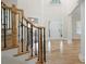 Grand foyer with hardwood floors, staircase, and soaring ceiling at 4711 Oakleigh Manor Dr, Powder Springs, GA 30127