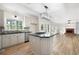 Modern kitchen with granite countertops, stainless steel appliances, and open layout at 4711 Oakleigh Manor Dr, Powder Springs, GA 30127