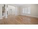 Spacious living room with hardwood floors, large windows, and ample natural light at 4711 Oakleigh Manor Dr, Powder Springs, GA 30127