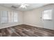 Living room with windows, a door to the outside, and wide plank flooring at 4711 Oakleigh Manor Dr, Powder Springs, GA 30127