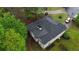 Birds eye view of house showing the roof and the surrounding greenery and other houses nearby at 5730 Paces Pl, Suwanee, GA 30024