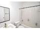 Clean bathroom with a shower-tub combination and modern fixtures at 5730 Paces Pl, Suwanee, GA 30024
