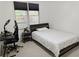 Cozy bedroom with a comfy bed, desk, and natural light from a window at 5730 Paces Pl, Suwanee, GA 30024