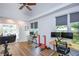 Spacious bonus room featuring multiple workstations and exercise equipment at 5730 Paces Pl, Suwanee, GA 30024