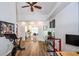 Open bonus room area with workstations, exercise equipment, and easy access to the kitchen at 5730 Paces Pl, Suwanee, GA 30024
