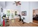 Bright bonus room with exercise equipment, a ceiling fan, and ample natural light at 5730 Paces Pl, Suwanee, GA 30024