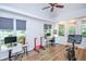 Versatile bonus room with multiple workstations and exercise equipment at 5730 Paces Pl, Suwanee, GA 30024