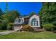 Charming two-story home with a well-maintained lawn, lush landscaping, and an attached two-car garage at 5730 Paces Pl, Suwanee, GA 30024