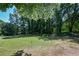 Expansive view of the lush green golf course with trees and some artificial golf balls at 5730 Paces Pl, Suwanee, GA 30024