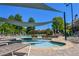 Inviting hot tub and pool area with comfortable seating, shaded canopy, and lush landscaping for relaxing outdoors at 5730 Paces Pl, Suwanee, GA 30024