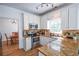 Updated kitchen with stainless steel appliances, granite countertops, and access to the dining room at 5730 Paces Pl, Suwanee, GA 30024