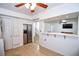 Kitchen with stainless steel refrigerator, view to living room, and tile floor at 5730 Paces Pl, Suwanee, GA 30024