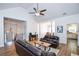 Bright living room features vaulted ceilings, wood floors, and views of dining room and entryway at 5730 Paces Pl, Suwanee, GA 30024
