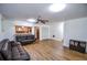 Inviting living room features hardwood floors, ceiling fan and an open layout at 5730 Paces Pl, Suwanee, GA 30024