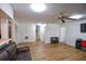 Bright living room with hardwood floors, ceiling fan, and stairs to upper level at 5730 Paces Pl, Suwanee, GA 30024