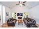 Bright living room features vaulted ceilings, fireplace, wood floors, and lots of natural light at 5730 Paces Pl, Suwanee, GA 30024