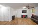 Open living room with hardwood floors and neutral color scheme at 5730 Paces Pl, Suwanee, GA 30024