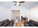 Bright living room with vaulted ceilings, wood floors, and view of the entryway at 5730 Paces Pl, Suwanee, GA 30024