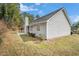 Exterior view of home with siding, a chimney, and a private backyard at 619 Rivulett Ct, Lawrenceville, GA 30043
