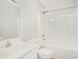Clean bathroom featuring a shower-tub combo, white cabinets, and a bright vanity at 619 Rivulett Ct, Lawrenceville, GA 30043