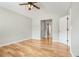 Spacious bedroom featuring vaulted ceiling, neutral paint, hardwood floors and ample closet space at 619 Rivulett Ct, Lawrenceville, GA 30043