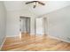 Spacious bedroom featuring vaulted ceiling, neutral paint, hardwood floors and ample closet space at 619 Rivulett Ct, Lawrenceville, GA 30043
